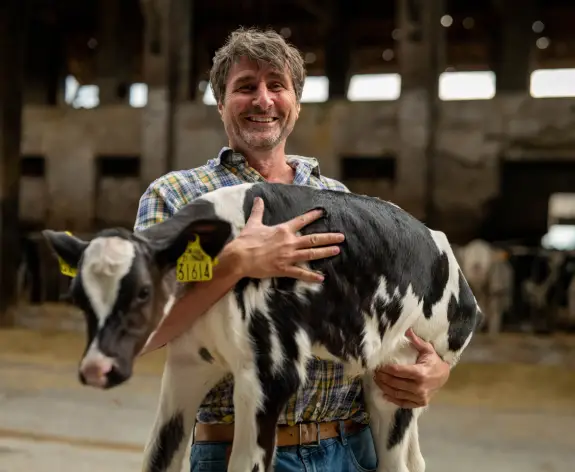 Man holding calf